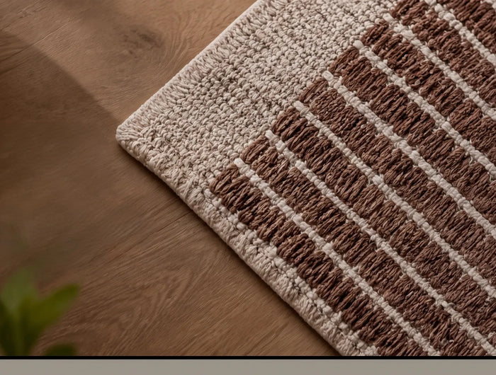 Artisan crafting a handmade rug using traditional weaving techniques in India